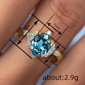 Aqua Oval Floral Cluster Three-Stone Ring In Two Metal Tones view 4