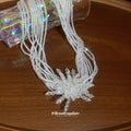 White Multi Strand Bead Necklace With Crystal Starburst view 2