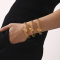 Double Layer Textured Open Ball Tip Bangles Gold and Steel view 1
