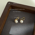 Gold Tone Hook Earrings With White Pearl Drops In Three Sizes view 8