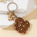 Beaded Bronze Knot Keychain With Rhinestone Flower Charm view 2