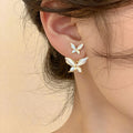 Gold Tone Pearlescent Double Butterfly Drop Stud Earrings view 1