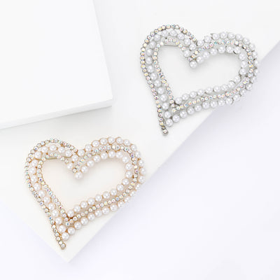 Front product view of the double heart pearl and crystal brooch on a light background