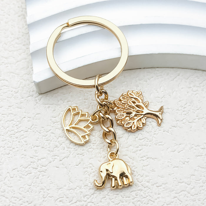 Gold-Tone Elephant Keychain With Lotus And Tree Charms