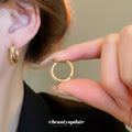 Polished Round Huggie Earrings in Silver Tone and Gold Tone view 4