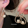 Abstract Hoop Pearl Drop Earrings In Two Metal Tones view 1