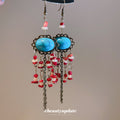 Turquoise Oval Beaded Chandelier Earrings With Red Accents view 2