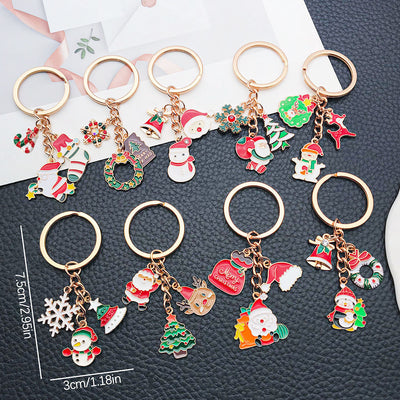 Front product photo of santa snowman reindeer and tree holiday keychain showing the pictured design arrangement