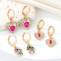 Gold Tone Crystal Heart, Lightning, Eye and Hamsa Huggie Earrings view 1