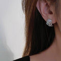 Silver Rose Petal Pave Huggie Earrings Clear Center Stone view 3