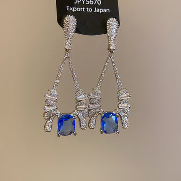 Silver Tone Geometric Drop Earrings With Blue Crystals