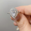 Silver Tone Pear Center Halo Ring With Pavé Shoulders view 4