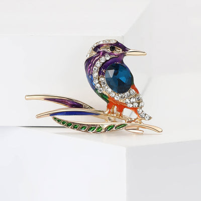 Colorful Crystal Woodpecker Brooch shown against a white display background