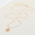 Gold Tone Crystal LOVE Heart Pendant Necklace and Huggie Earrings view 4