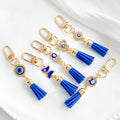 Gold Tone Evil Eye Charm Keychain with Blue Tassel and Rhinestone Accents view 2