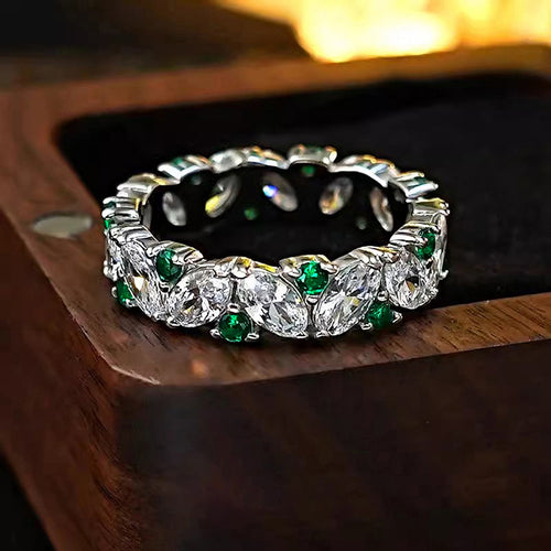 Second product view showing silver-tone eternity band with clear marquise and green round stones