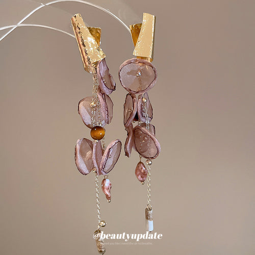 Close view of the colors and surface details on brown chiffon flower tassel earrings