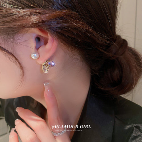 Crystal Leaf and Pearl Drop Gold Tone Stud Earrings shown in ear-worn front view