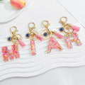 Pink Confetti Resin Letter Evil Eye Charm Tassel Keychain view 1