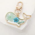 Gold Tone Pressed Flower Whale Resin Clip Keychains in Eight Designs view 9