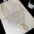 Layered Pearl And Gold Tone Heart Necklace Set With Decorative Accents view 2