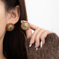 Brown Round Letter Medallion Gold Tone Stud Earrings view 1