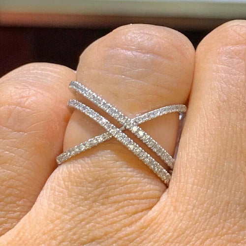 Second product view showing silver-tone triple crisscross pave open ring