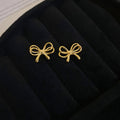 Minimal Bow Stud Earrings in Gold Tone or Silver Tone view 6