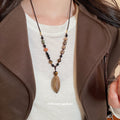 Brown Beaded Cord Necklaces with Botanical Pendants view 3