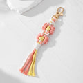 Gold Tone Woven Daisy Tassel Clip Keychains in Two Colorways view 7