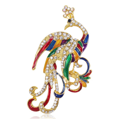 Front view of the colorful crystal phoenix brooch with curled tail decorative clothing pin on a white background