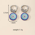 Gold and Silver Tone Multi Ring Crystal Evil Eye Huggie Earrings view 4