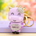 Smiling Cow Keychain with Beige Enamel and Crystal Flower Accent view 4