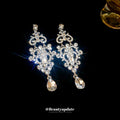 Silver Tone Ornate Openwork Crystal Teardrop Earrings view 2