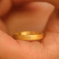 Matte Gold Tone Closed Band Ring With Tiny Starburst Crystal view 2