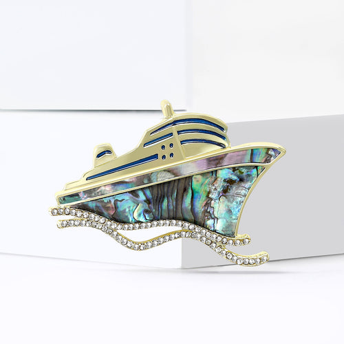 Angled close-up showing crystals on the shell inlay cruise ship brooch