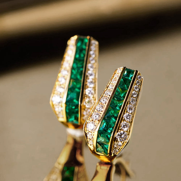 Gold Tone Green Channel Set Huggie Hoop Earrings With Clear Accents