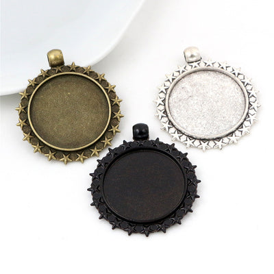 Floral Edge Round Cabochon Pendant Bases in Two Finishes shown in a grouped front view