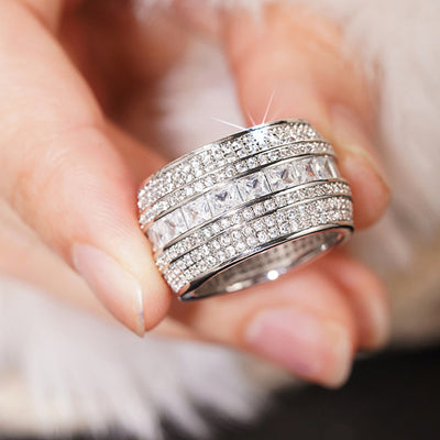 Product view showing baguette and round clear stone multi-row extra-wide ring silver tone