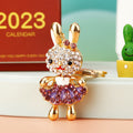 Jeweled Skirt Holding Rabbit Keychains with Plain and Fortune Loops view 1