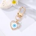 Gold Tone Enamel and Crystal Heart Evil Eye Clip Keychains view 9