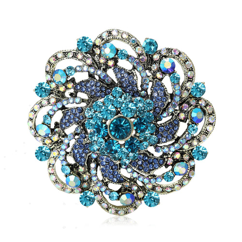 Blue antique silver rhinestone sun flower swirl brooch front view