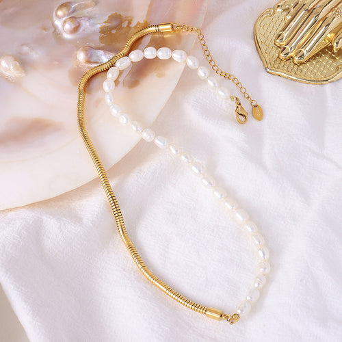 Full necklace flat lay showing pearls snake chain clasp and extender