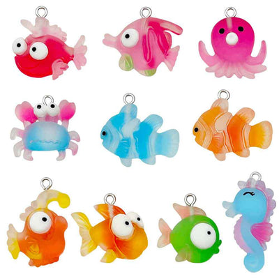 Multicolor seahorse and octopus charms arranged on a light background