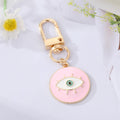 Gold Tone Enamel Lash and Crystal Evil Eye Clip Keychains view 2