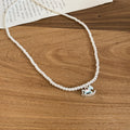 White Beaded Necklace with Blue Enamel Rocking Horse Pendant view 6