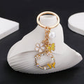 Yellow Openwork Butterfly Flower and Faux Pearl Charm Keychain view 3