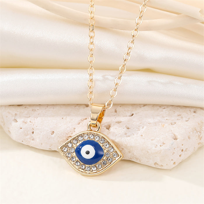 Gold Tone Crystal Outline Blue Evil Eye Pendant Necklace