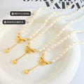 Pearl Bead Necklace with Gold Bow and Heart Drop Pendant view 2