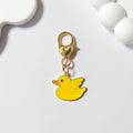 Gold Tone Yellow Duck Heart-Clasp Charms in Twelve Playful Designs view 9